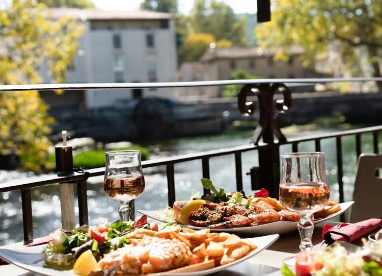 Gourmet dinner for two at a riverside location on a cycling holiday